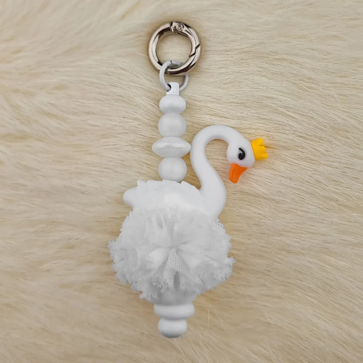 This kit contains all the supplies for being able to make a homemade Key / Phone Pendant Swan White with Ruche with silicone beads. Jootjes Haakcadeautjes